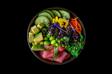 Buddha bowl with tuna, avocado, green beans, cucumber. Diet healthy nutritious food. Ready menu for the restaurant on black background. Sushi menu. Japanese food.