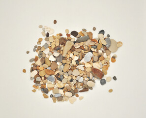 rounded gravel on a white background, isolated sea beach pebbles