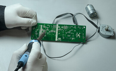 Working with a soldering iron - obrazy, fototapety, plakaty