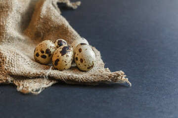Fresh quail eggs on a dark background