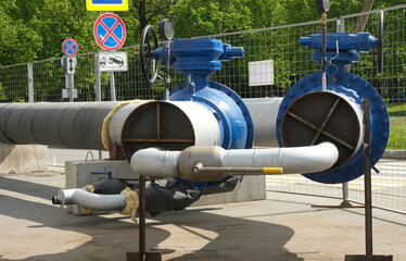 Fototapeta na wymiar Gas pipes with blue valves.
