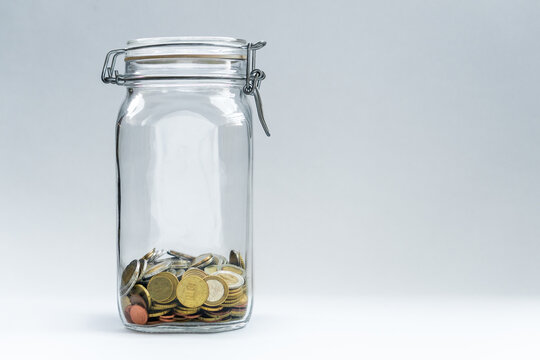 Isolated Jar with Coins and clean background with space for text