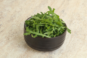 Fresh green arugula in the bowl