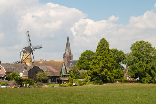 Mill and church tower in the rural village of Cothen.