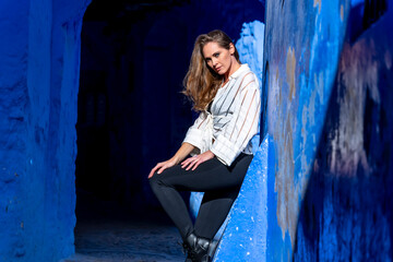 A Model Poses In The Famous City Of Chefchaouen Also Known As The Blue Pearl