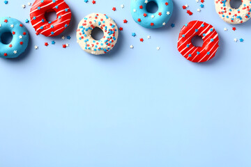 4th of July background with donuts in American flag colors and confetti on blue. Happy Independence...