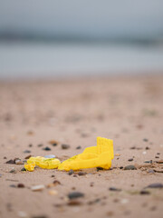 Fototapeta na wymiar yellow toy on the beach
