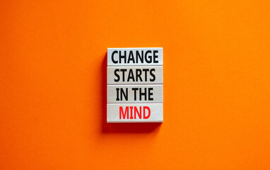 Change starts in the mind symbol. Concept words Change starts in the mind on wooden blocks on a beautiful orange table orange background. Business, motivational and change starts in the mind concept.