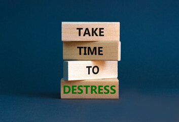 Take time to destress symbol. Concept words Take time to destress on wooden blocks. Beautiful grey table grey background. Psychological business and take time to destress concept. Copy space.