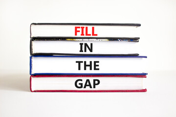 Fill in the gap symbol. Concept words Fill in the gap on books on a beautiful white table white background. Business, motivational and fill in the gap concept.