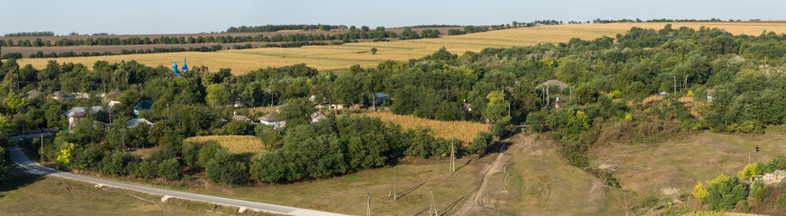 Landscapes of the Northern regions of Moldova. A pastoral panorama with nature. Moldovan villages and houses and streets.