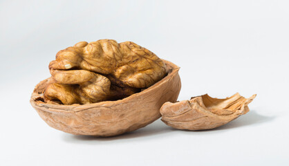 Walnuts are rounded, single-seeded stone fruits of the walnut tree. Cracking a nut.