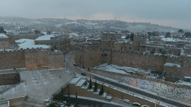 Jerusalem the old city walls in the snow aerial view
Drone footage from East Jerusalem in the winter, old city, israel
