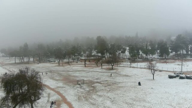 Jerusalem Park (gan sacher) in the snow aerial view, morning
People having fun in thw snow Jerusalem, aerial view
