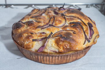 Italian bread - traditional two pieces of focaccia. Focaccia consists of flour, olive oil, water, Fleur de sel, sugar and yeast, topped with rosemary and baked