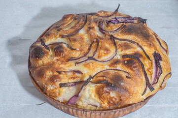 Italian bread - traditional two pieces of focaccia. Focaccia consists of flour, olive oil, water, Fleur de sel, sugar and yeast, topped with rosemary and baked