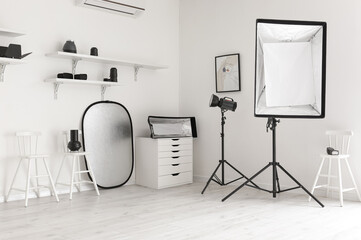 Lighting equipment in modern photo studio