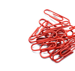 Red paper clips on white background