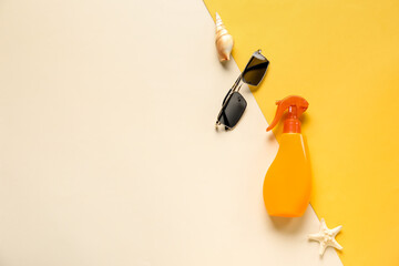 Spray bottle of sunscreen with sunglasses, seashell and starfish on color background