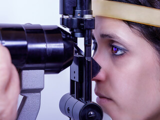 Eye medical examination. Eye doctor visits the patient using a special tool. Pachymetry is a...