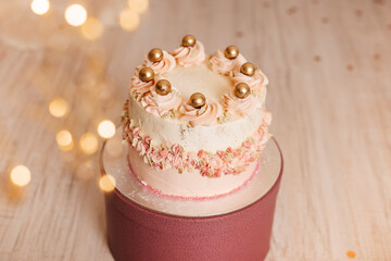 Stand with delicious birthday cake against light background