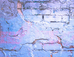 Brick wall. Paint spots. Abstract purple background. Holographic neon colors. Rock texture. Stone background. Rock holography. Multicolored Painted Wall. Wall abstraction.