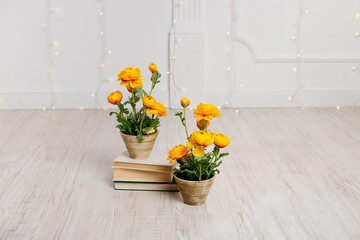 artificial yellow flowers in a beautiful pot. Spring composition.