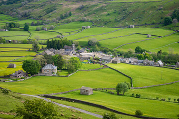 On the Coast to Coast long distance footpath walk at Muker in Swaledale in the Yorkshire Dales