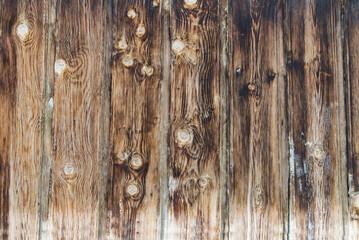 close-up of a wooden wall made of vintage planks with natural texture.
