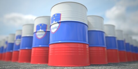 Barrels or oil drums with flag of Slovenia. Petroleum or chemical industry related 3D rendering