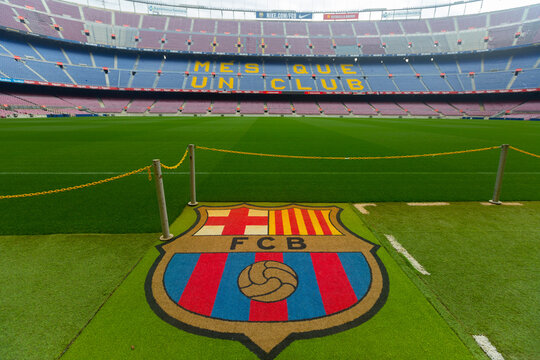 BARCELONA, SPAIN - MAY 23, 2021: Football Club Barcelona emblem on grass of empty Camp Nou stadium field