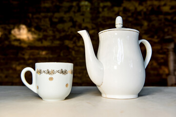 Antique porcelain coffee teapot and cup