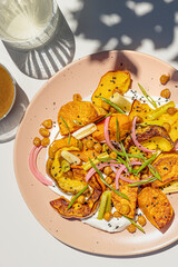Roasted squash salad with crispy chick peas and pickled onion