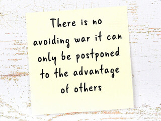 Wise quote on sticky note on wooden wall