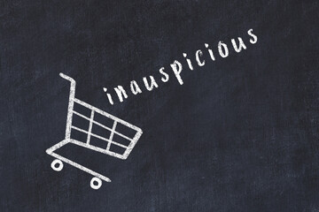 Chalk drawing of shopping cart and word inauspicious on black chalboard. Concept of globalization...