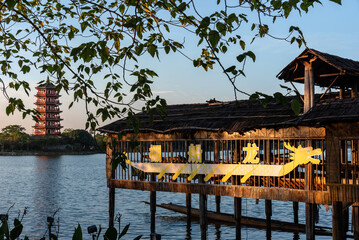 Stilt house for dragon boat built on HuaYang lake in Machong, DongGuan, China. Dragon Boat Festival, chinese traditional culture. Chinese text"long chuan peng"Translation "Dragon Boat Shed".