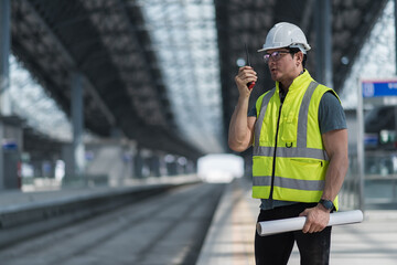 Obraz na płótnie Canvas worker in uniform. engineer standing in depot and railway inspection. Construction worker on railways. Engineer work on railway. rail, engineer, Infrastructure