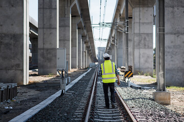 Engineer standing in depot  and railway inspection. construction worker on railways. Engineer work...