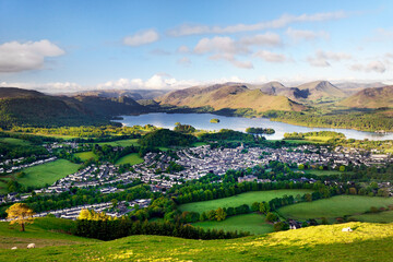 Lake District National Park, Cumbria, England. South over Keswick town and Derwentwater to Borrowdale. Summer morning