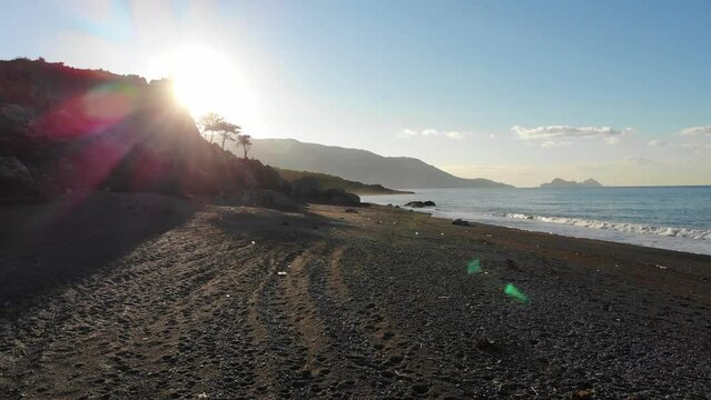 Drone View Of The Sea Beach With Calm Waves In The Morning Sunlight