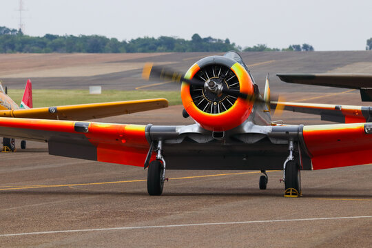 Classical Aerobatic Airplane At Airport With Running Engine