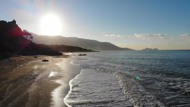 Drone Aerial View Of The Sea Beach With Quiet Waves In Beautiful Morning Sunlight