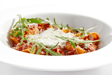 Italian pasta pappardelle with bolognese sauce  and parmesan isolated on white background. Pasta tagliatelle with meat ragu and creamy espuma with arugula. Minced beef in tomato sauce with pasta.