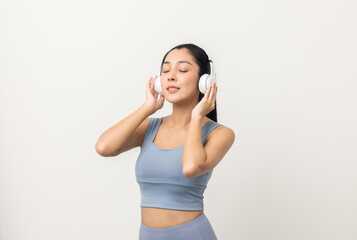 Naklejka premium Sexy sporty fitness asian woman with sportswear put on headphone isolated white background. Portrait Good shape and healthy woman standing pose exercise workout in studio.