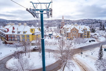 View on the Tremblant ski resort and the surrounding trees and ski resort on a snowy winter day...