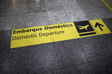 sign on floor airport domestic departure