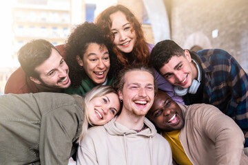 Selfie of young smiling teenagers having fun together outside - Happy life style concept with young multiracial students having fun together