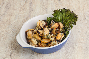 Tasty marinated mussels in the bowl