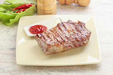 Grilled rib-eye steak beef meat