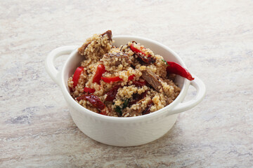 Arabic cous cous with meat and tomato